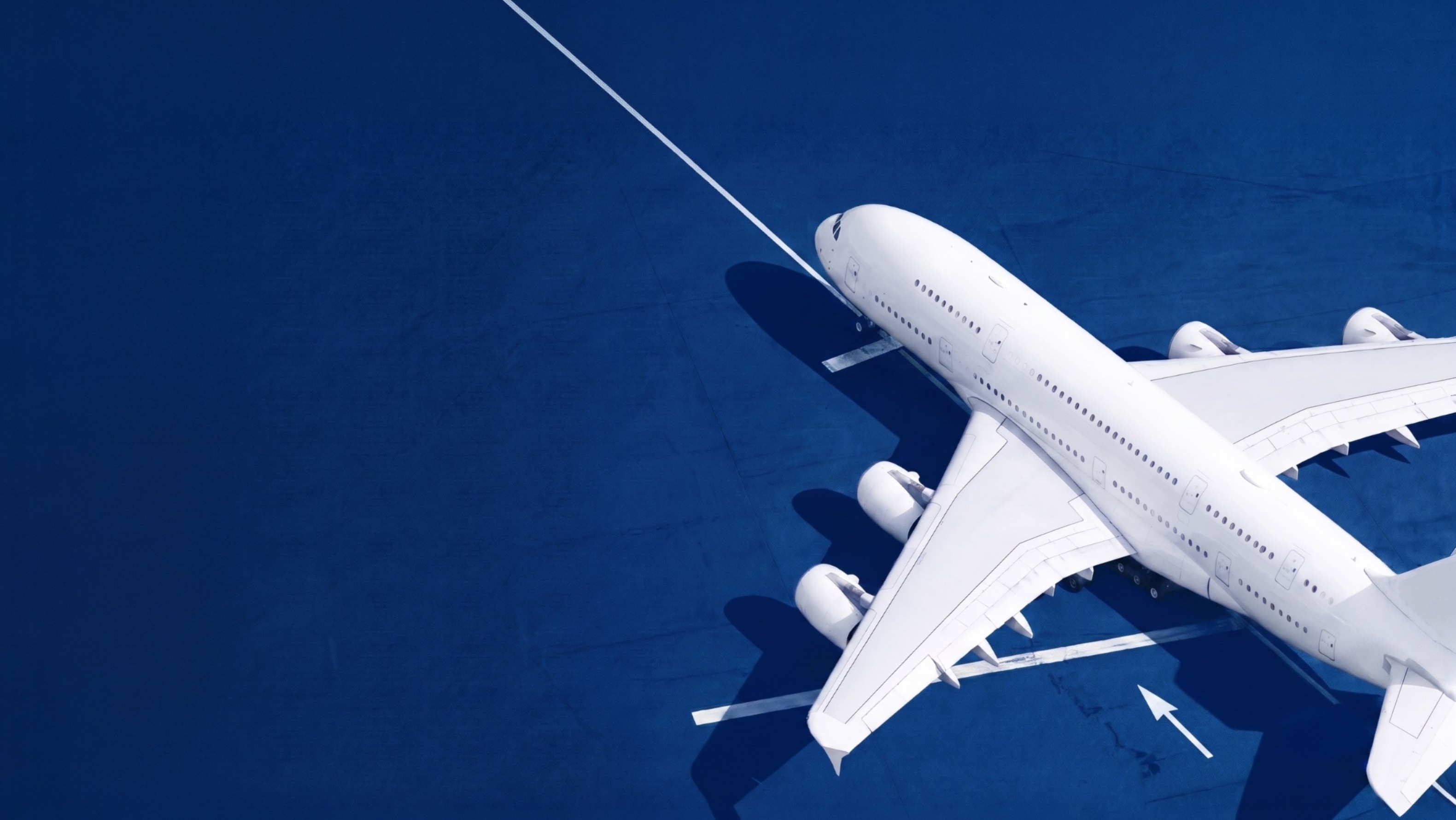 An airplane parked on the airport tarmac